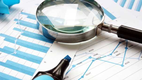 Magnifying glass and charts