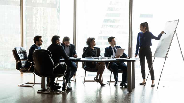 Staff working in boardroom